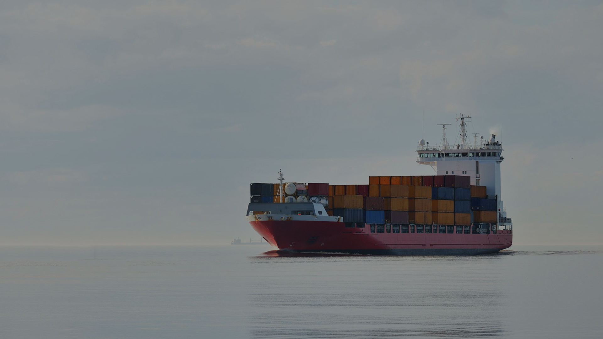 large cargo ship with cargo at the sea