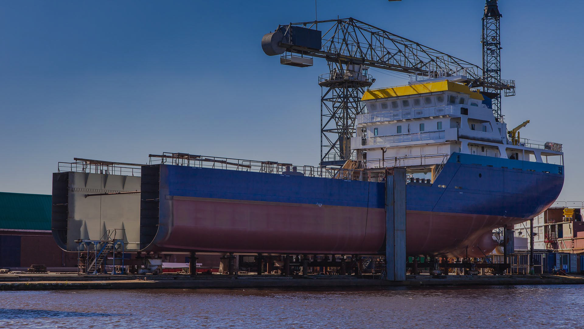 large cargo ship on land being repaired